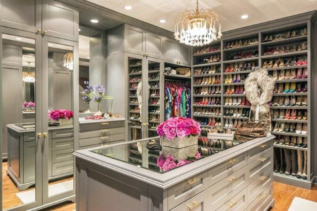 luxury walk-in closet with shoe storage