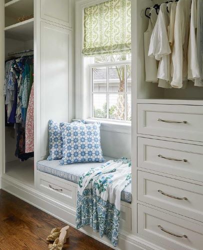 luxury walk-in closet with window seat