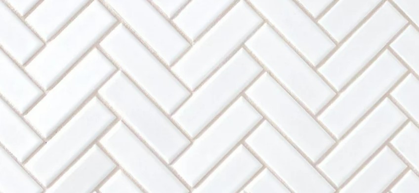 subway tiles installed in herringbone pattern