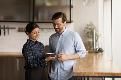 People reviewing search results on tablet