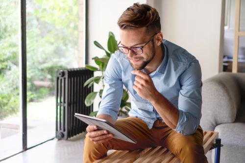 man searching on laptop for successful website