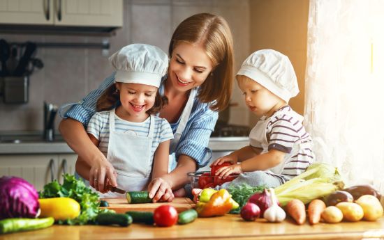 family with children in kitchen