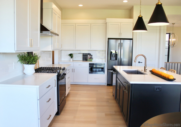 White kitchen with black stainless appliances