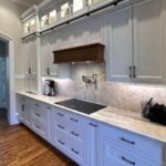 Custom hood treatment in kitchen featuring Brighton Custom Cabinetry