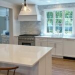 Integrity Cabinets in transitional kitchen with windows over sink