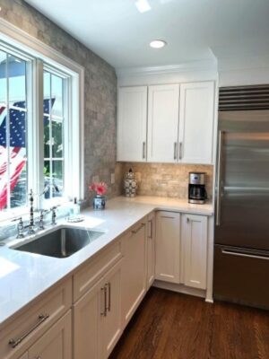 Integrity Cabinets in kitchen with molding above wall cabinets