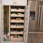 Utility pantry cabinet with roll out shelves from Brighton Custom Cabinetry