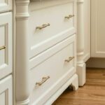 Turned posts and furniture feet on Brighton traditional kitchedn